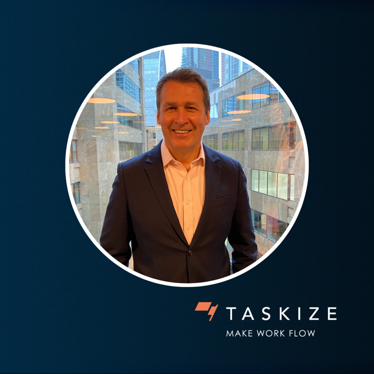Headshot of new Global Head of Sales, Alan Samuel, on a Taskize navy coloured background